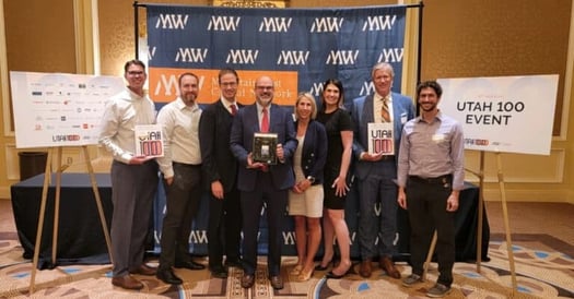 Cidi Labs employees proudly displaying award